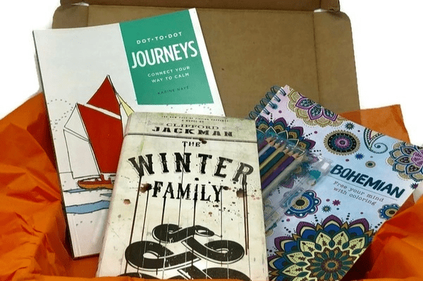 Books and Writing supplies provided by Coloring and Classics Box under their subscription plans 