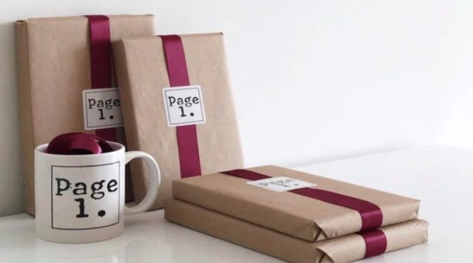 Set of paperbacks and hard covers with a coffee mug under subscription plan of Page 1